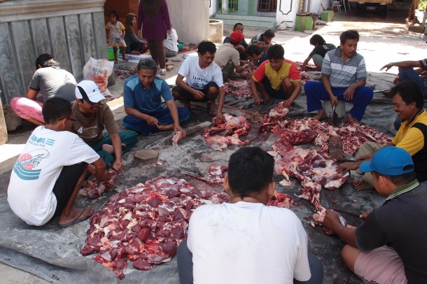 The scene I rolled into: all the neighborhood men butchering and dividing up 9 goats and one cow.