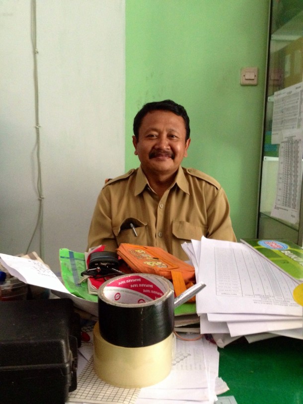 Pak Warai sitting at his office, where we've had all of our numerous conversations.